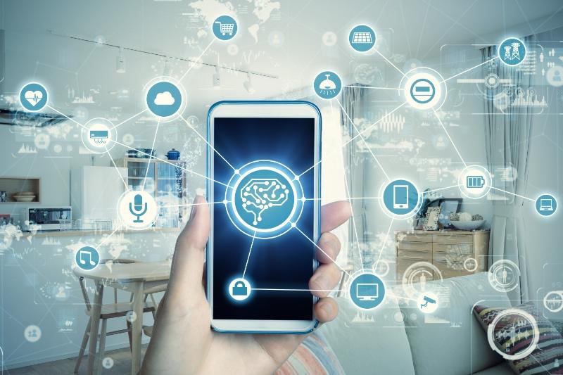 Artificial Intelligence and HVAC? Image is a photograph of a house as a backdrop and in the front is an iPhone with illustrated features surrounding it in blue circles connected to the phone by a thin line.